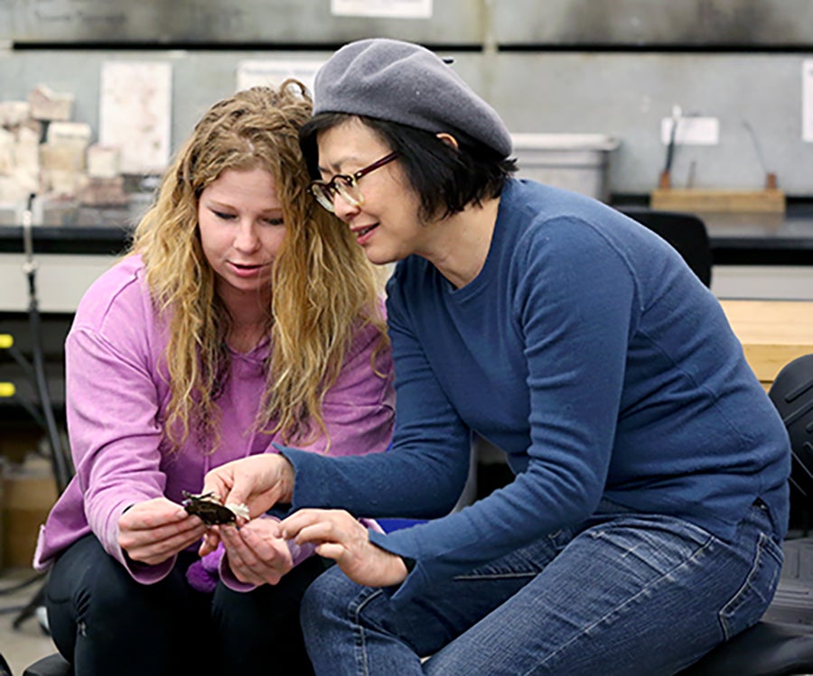 Mindy Allee and Associate Professor Masako Onodero talk about Allee's brooch.