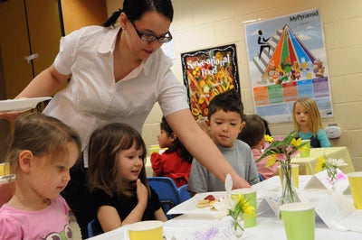 Karen Ostenso working with children at UW-Stout Child and Family Care Center