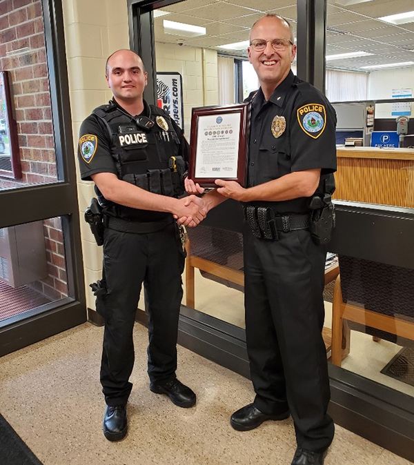 UW-Stout student Grant Kjellberg, of Eau Claire, at left, pictured with UW-Stout Police Chief Jason Spetz. Kjellberg is a part-time officer with the UW-Stout Police Department and is deploying to the Middle East.