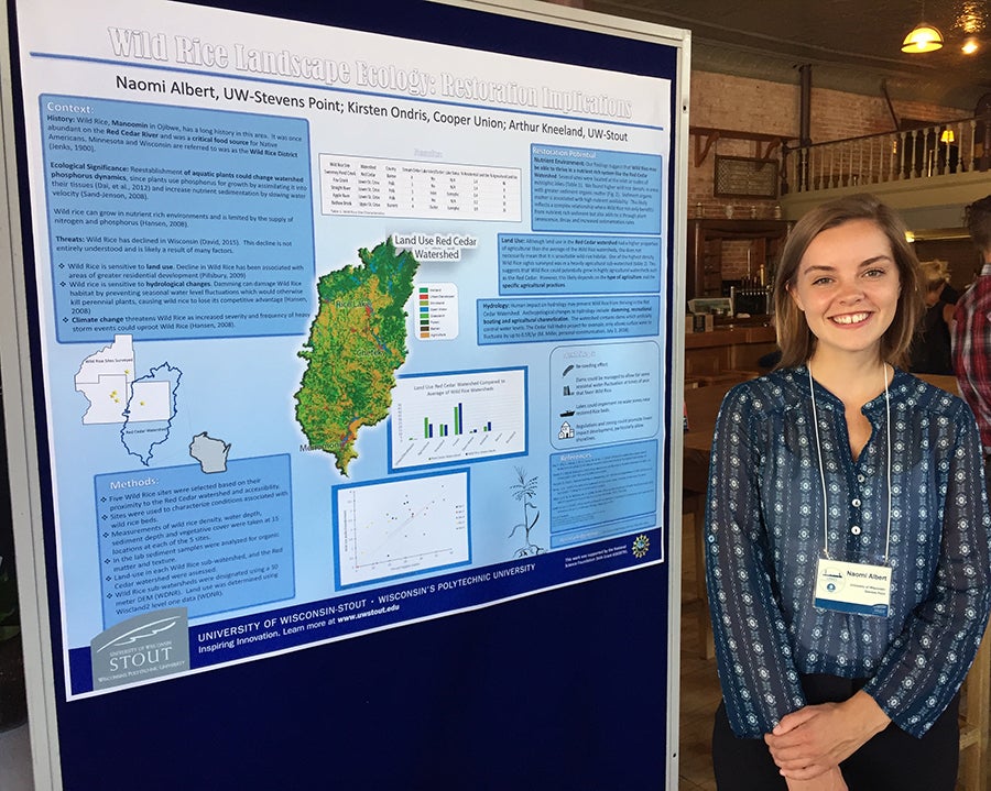 LAKES student Naomi Albert with her poster on research she did on wild rice./UW-Stout photo Pam Powers