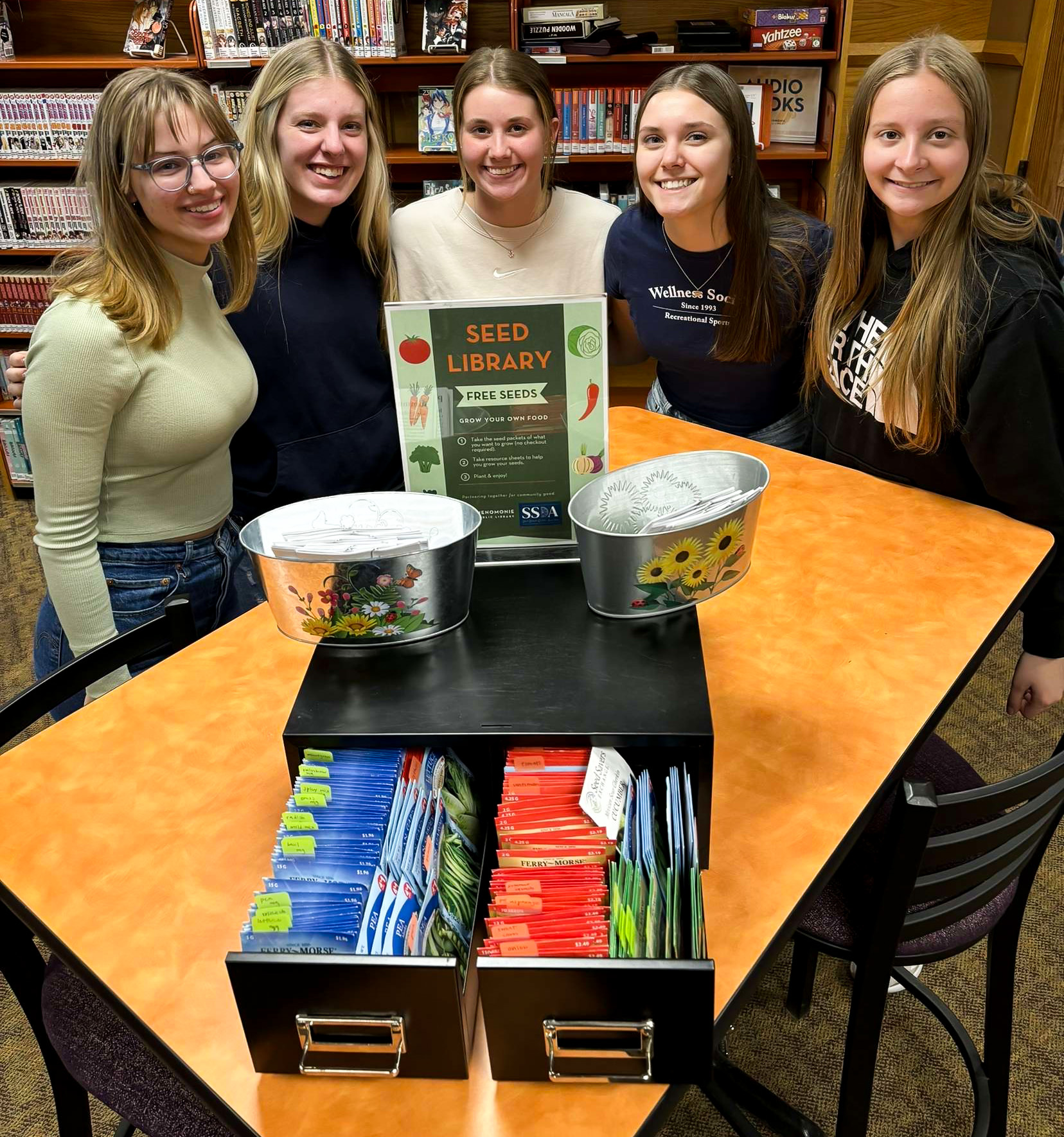 Students display seed library.