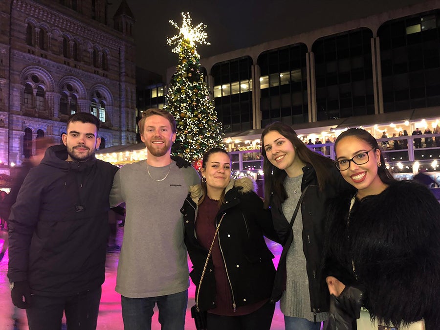 Maxwell Corner, second from left, enjoys a holiday celebration in Europe with other international students.