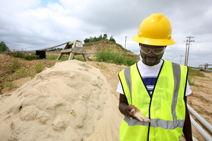 Fairmount Minerals operates a sand mine on the east edge of Menomonie. A member of the Young African Leaders Initiative at UW-Stout tours the mine in 2014.