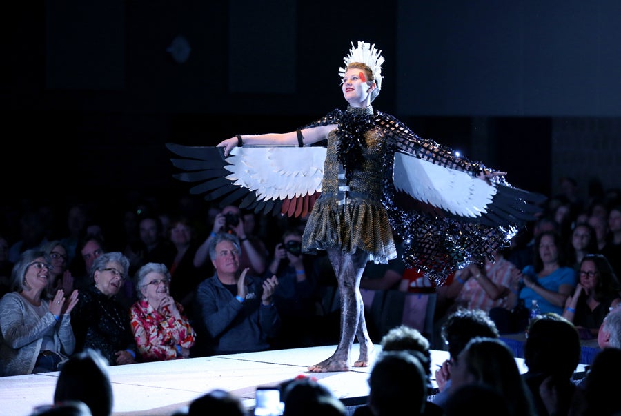 "Crowned Flight" created by students Audrey Groneck and Lucas Thomas is modeled by Groneck at the 2017 Fashion Without Fabric show.