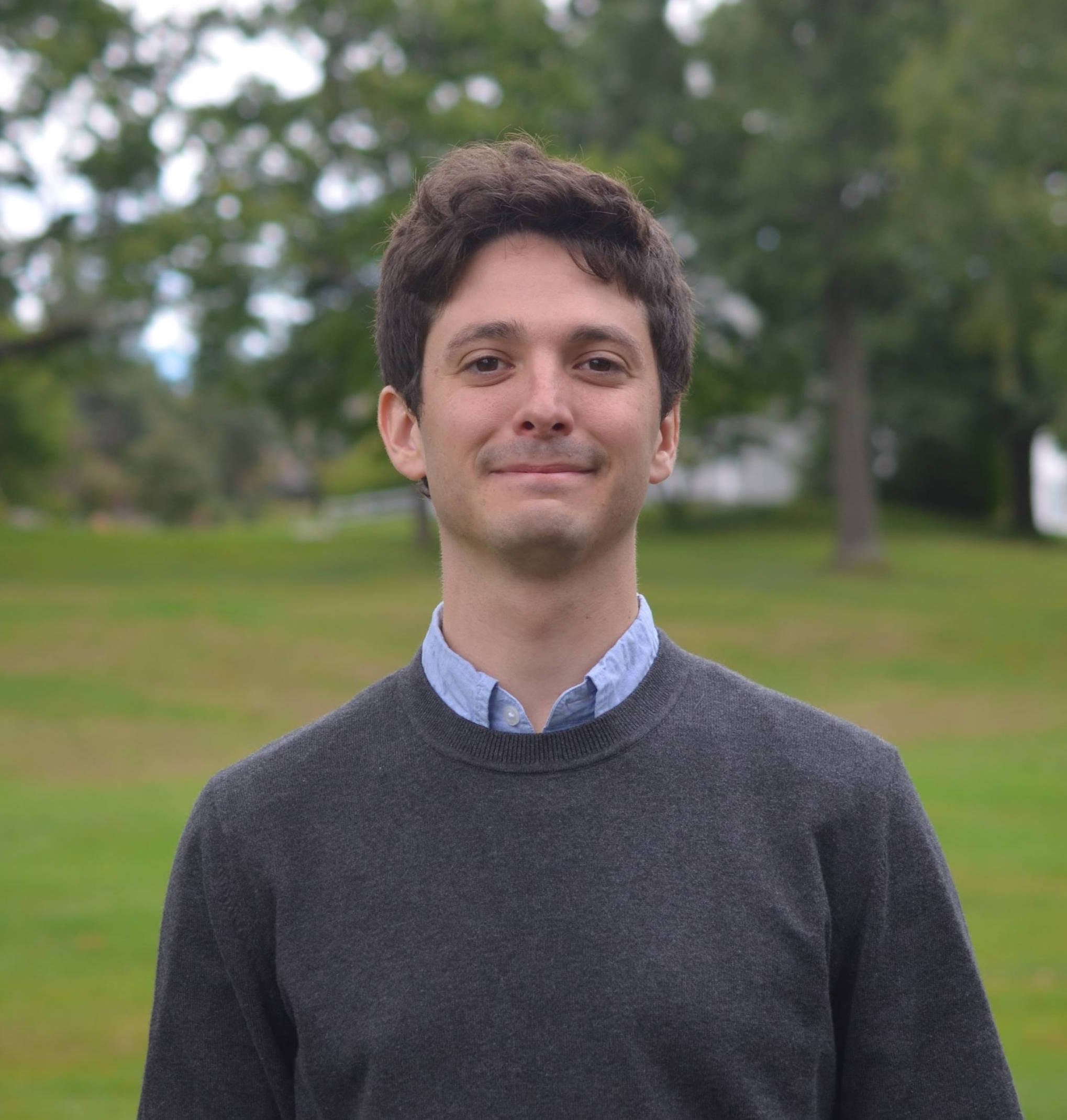 J.P. Messina standing outside smiling to the camera