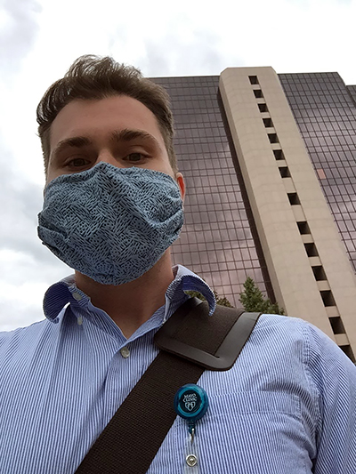 Jack Hemsath wears a protective mask outside Mayo Clinic in Rochester, Minn., where he works in the Infectious Diseases Lab.