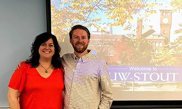 Andria Morse and Maxwell Corner give a presentation in London about UW-Stout.