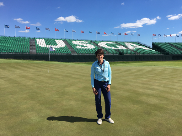 Kris Schoonover stands on the 18th green prior to the U.S. Open at Erin Hills. Schoonover is an assistant professor at UW-Stout and works in golf operations at Erin Hills.