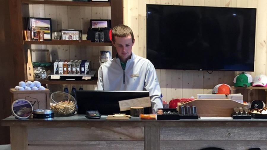 UW-Stout student Drew Ringelstetter, who received a scholarship from the Golf Course Owners of Wisconsin, works at the front desk at Sand Valley Golf Resort in Wisconsin.  