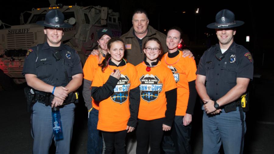 Police officers and runners take part in the 2015 Run With the Cops event at UW-Stout.