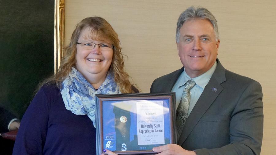 Jo Johnson receives the University Staff Employee Appreciation Award for January from Chancellor Bob Meyer.