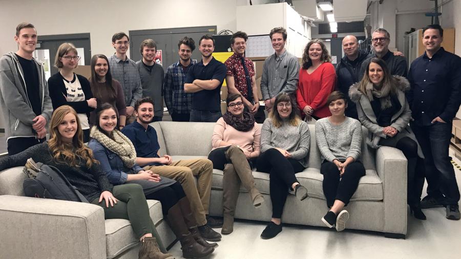 Industrial design students visit Room & Board, which donated the sofa and $2,000 to the program.