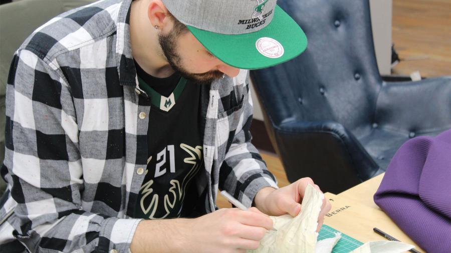 Alexander Mayhew, industrial design graduate, making a prototype of a sneaker.