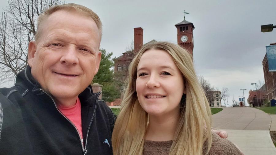 ABMB graduate Camrin Dressel with her dad, Mark, near the Bowman Hall Clocktower.