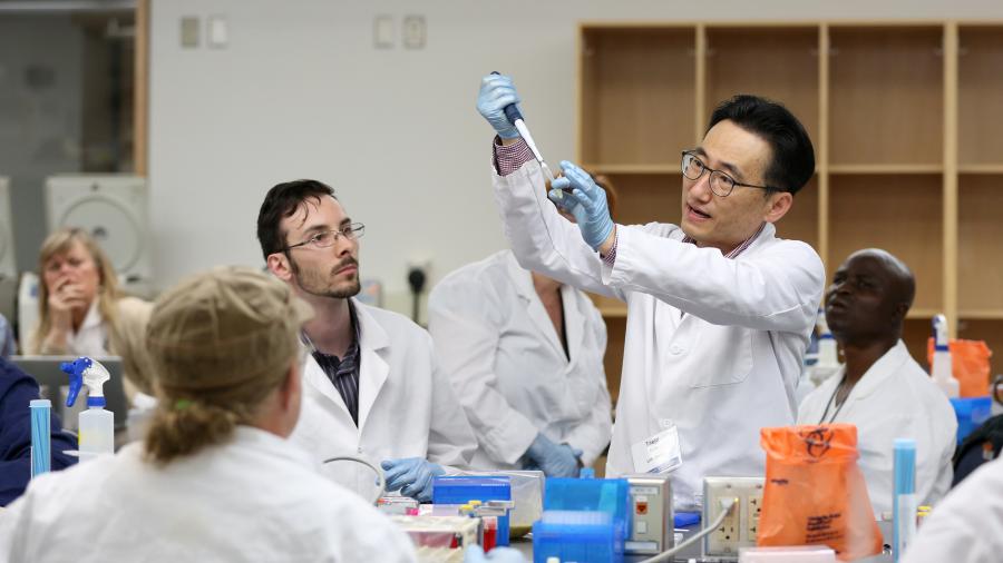 Taejo Kim, nutritional sciences department, works with industry professionals at a food safety workshop on campus. Kim been promoted to associate professor with tenure.