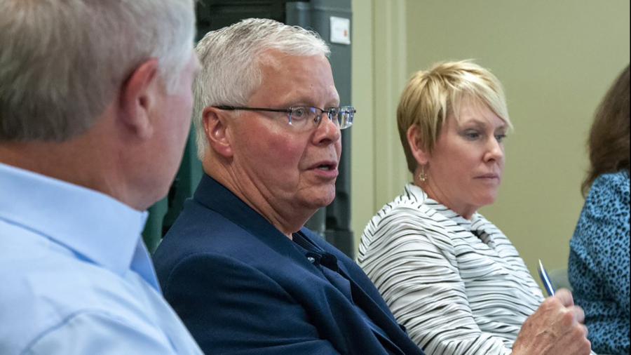 Jay Rothman speaks during the panel event, part of a daylong visit to the campus. At left is Dale Evans, an alum and CEO and Chairman of EVCO Plastics. At right is Chancellor Katherine Frank.