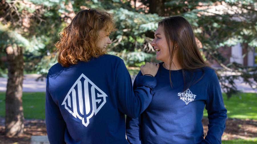 Willa Rodencal, left, and Megan Copeland, two of 13 UW-Stout Ambassadors for 2022-23, model the ambassadors’ Impact Project T-shirts.