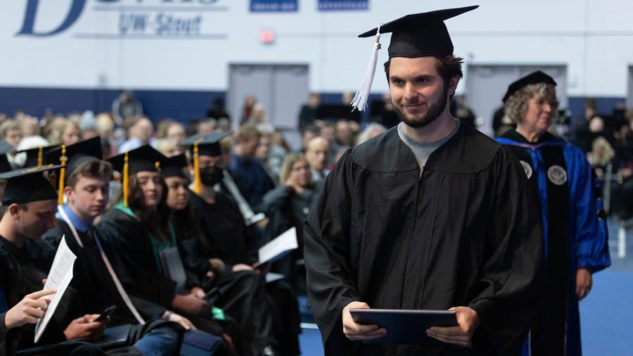 Ari Ben-Ami with his diploma at commencement on Dec. 17.