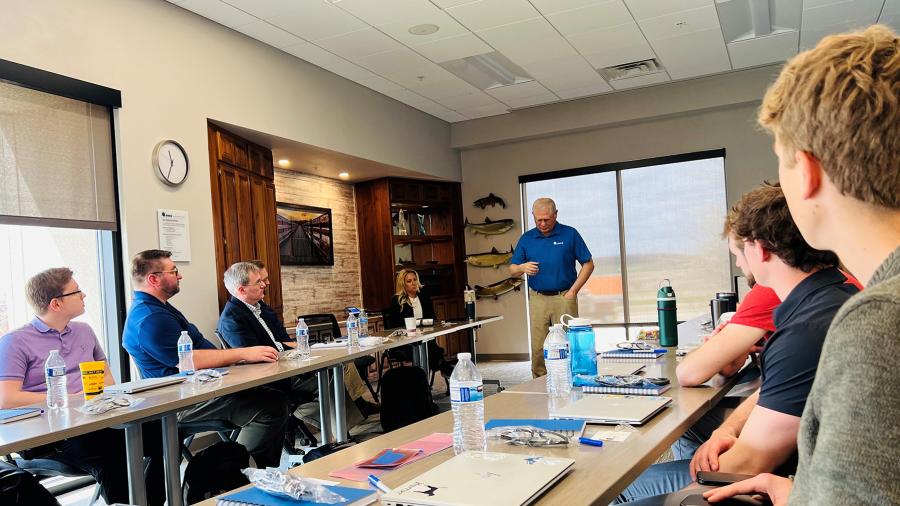 EVCO CEO Dale Evans, a UW-Stout alum, speaks during students’ research presentations.