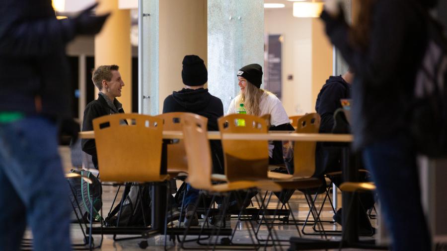 Students talking at a table