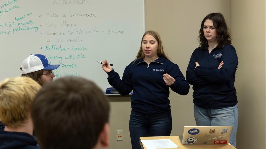 UW-Stout students lead high school students in a discussion about the teaching profession.