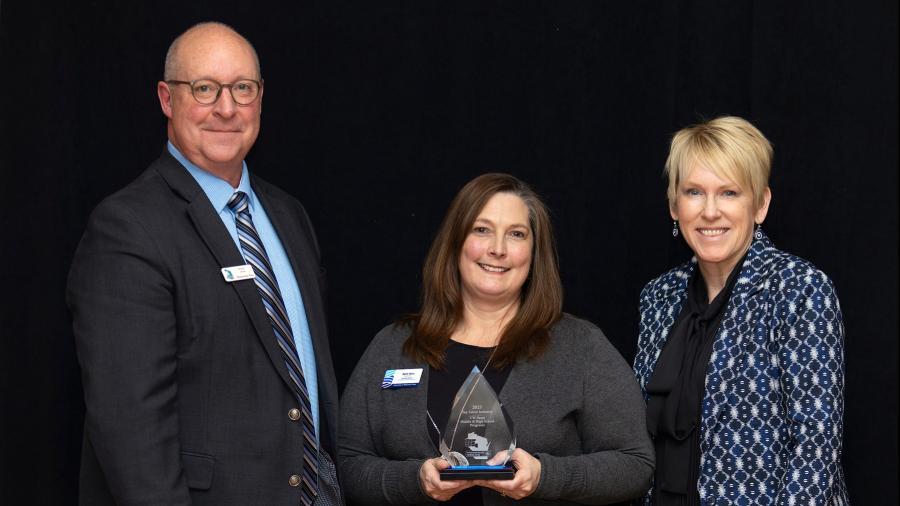 Beth Hein, center, executive director of Educational Pathways and Outreach, and Chancellor Katherine Frank accept UW-Stout’s Top Talent Initiative award from Momentum West’s Steve Jahn.