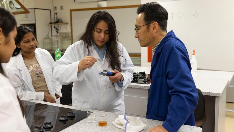 Food science students conduct glucose test in the lab