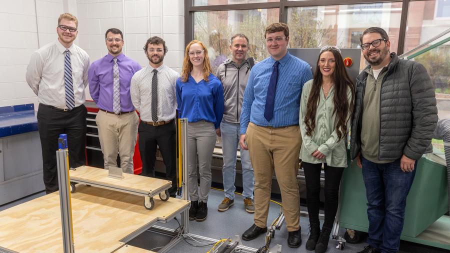 Students who created a robotic material handling cart: from left Isaac Nachtigal, Jordan Bowe, Carter Smith, Bridgette Allen, Steve Strusz from Viracon, Seth Gunderzik, Hattie Kipke and Peter Kuhlman from Viracon.