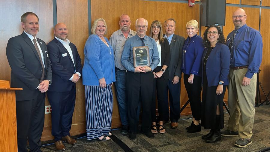 At the award ceremony, from left, Erik Guenard, Justin Fults, Sandi Scott, Brad Mengeling, Bob Cook, Aimee Lipke, Darrin Witucki, Katherine Frank, Glendalí Rodríguez and Zenon Smolarek.