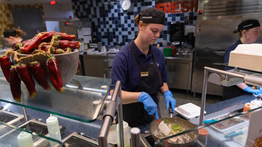 Liliana Mohror, a dietetics student, prepares an order at Fireside Café.