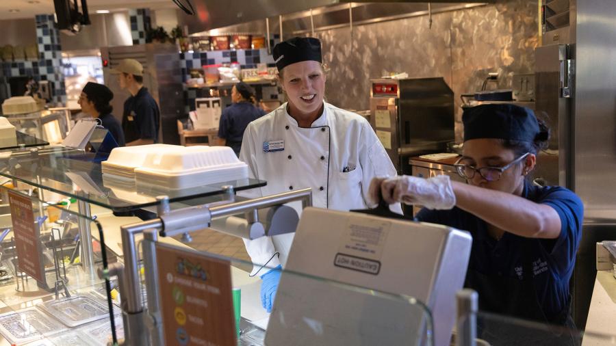Nicolle Demulling, a dietetics student, works at Fireside Café under the direction of Professor Kristal Gerdes.