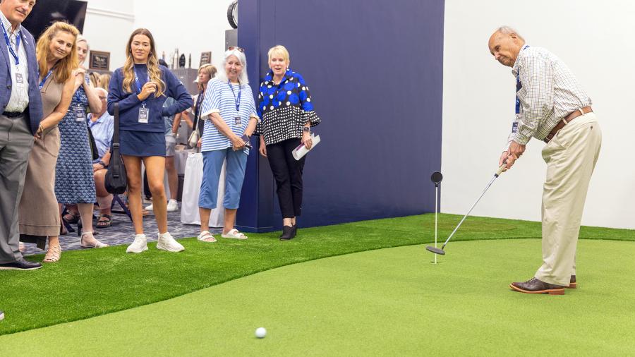 Mike Kell tries a putt at the new, indoor Pat Kell Golf Center in the Recreation Complex at UW-Stout.