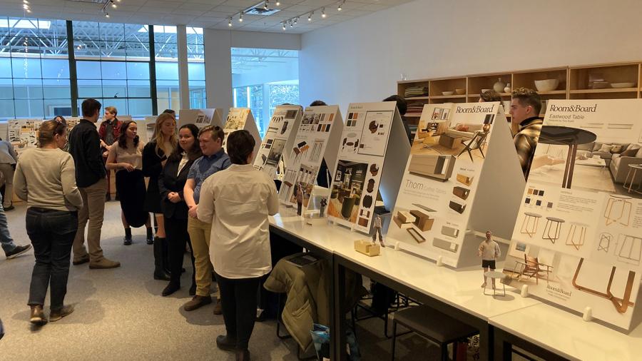 Students present their furniture concepts at Room & Board.