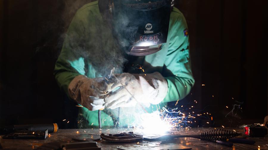 Sparks fly as a student in a welding class performs the Shielded Metal Arc Welding process.