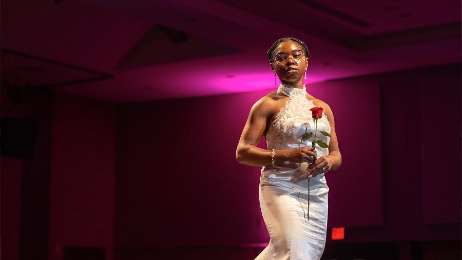 A student model poses in a stunning wedding dress at WEAR Fashion Show.
