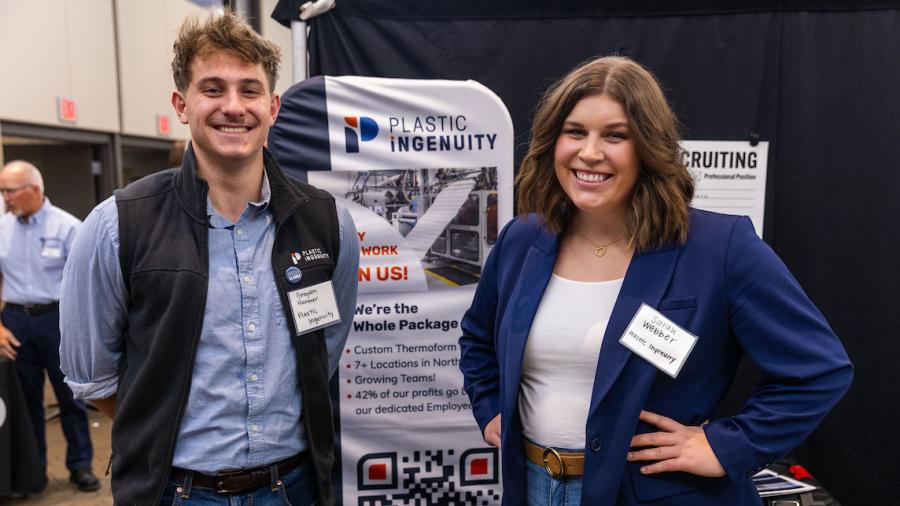 Plastic Ingenuity employees, alumni Greyson Hammer and Sarah Webber at the Stout Career Conference