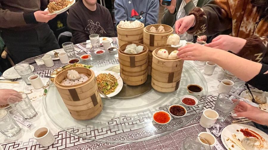 Stacked trays of dim sum dumplings.