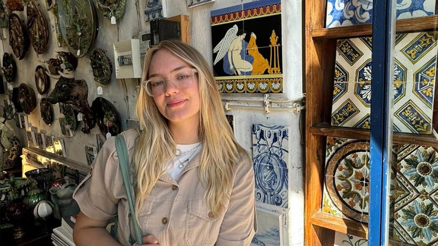 Woman posed with artwork