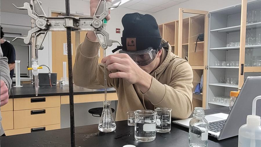 Honors chemistry students conduct an experiment on the hardness levels of campus water samples