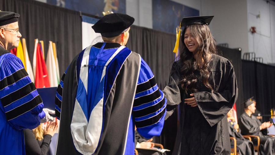 Woman accepting diploma