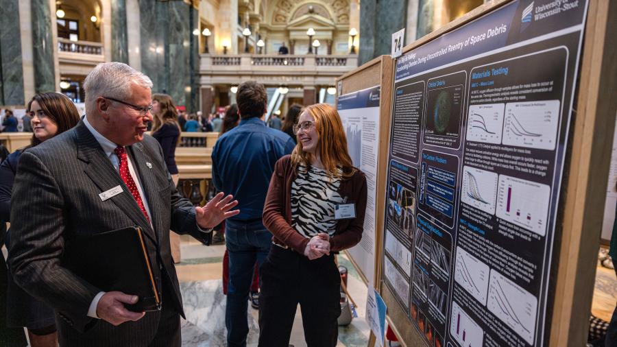 People in front of research display