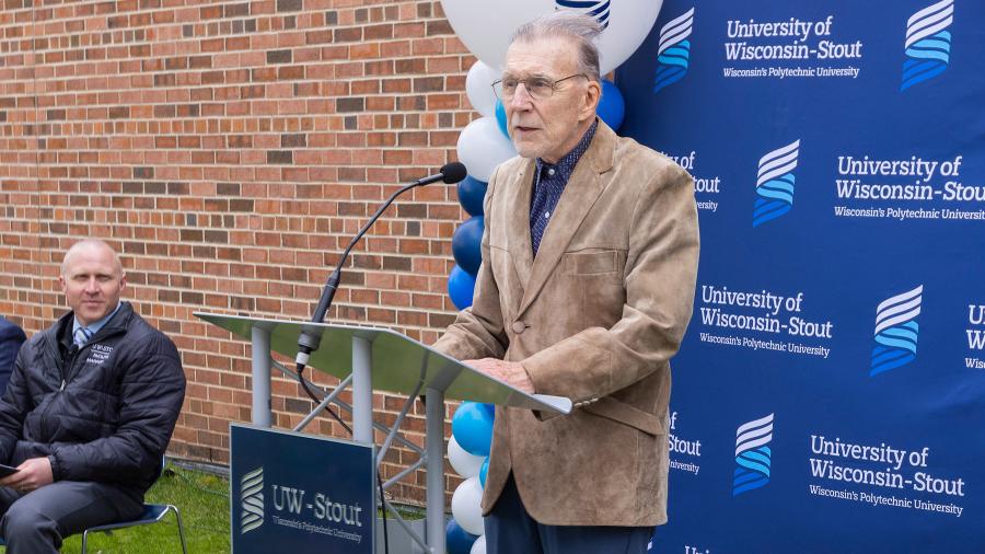 Man speaks at podium