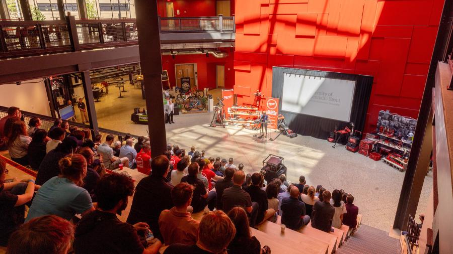 Woman speaks to large audience