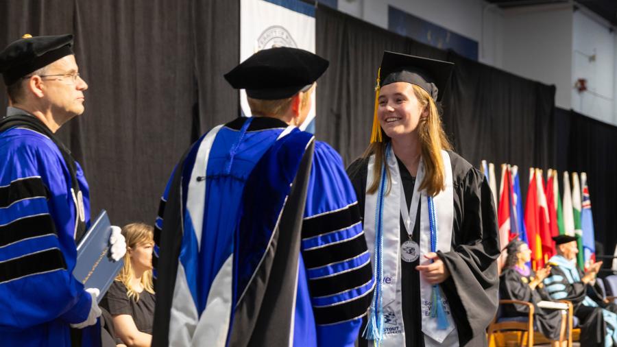 Woman receiving diploma