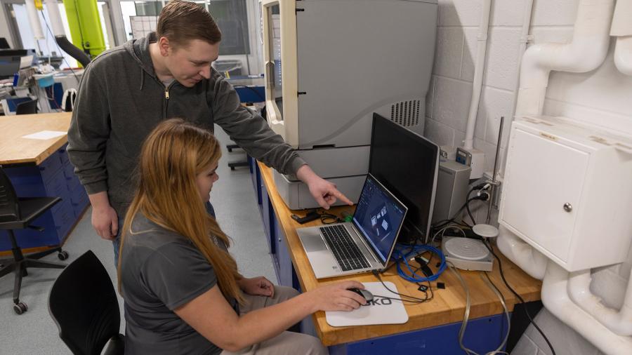Students work on computer