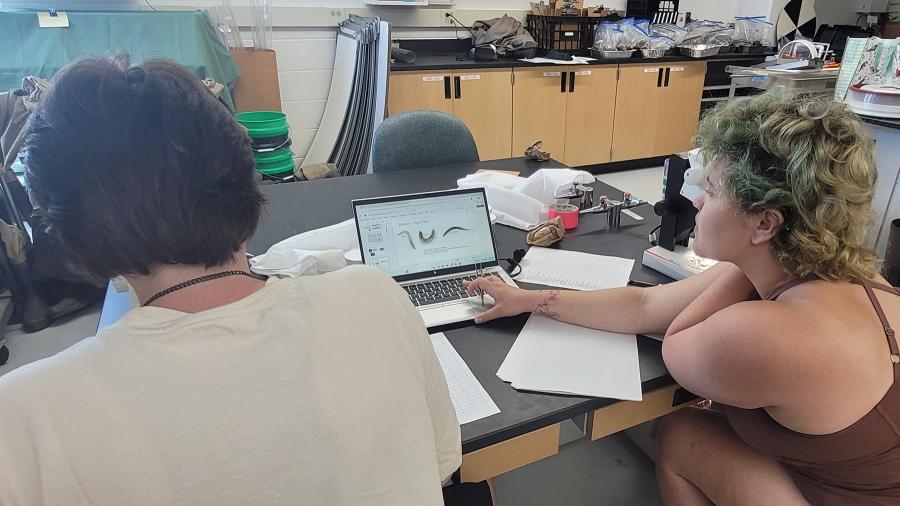 Abi Cherry and Norah Shires in a biology lab