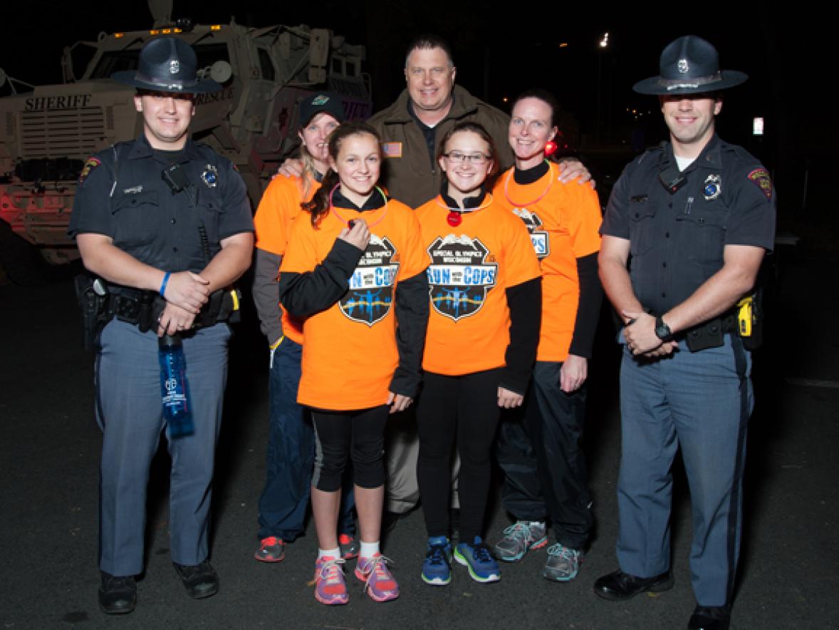 Police officers and runners take part in the 2015 Run With the Cops event at UW-Stout.