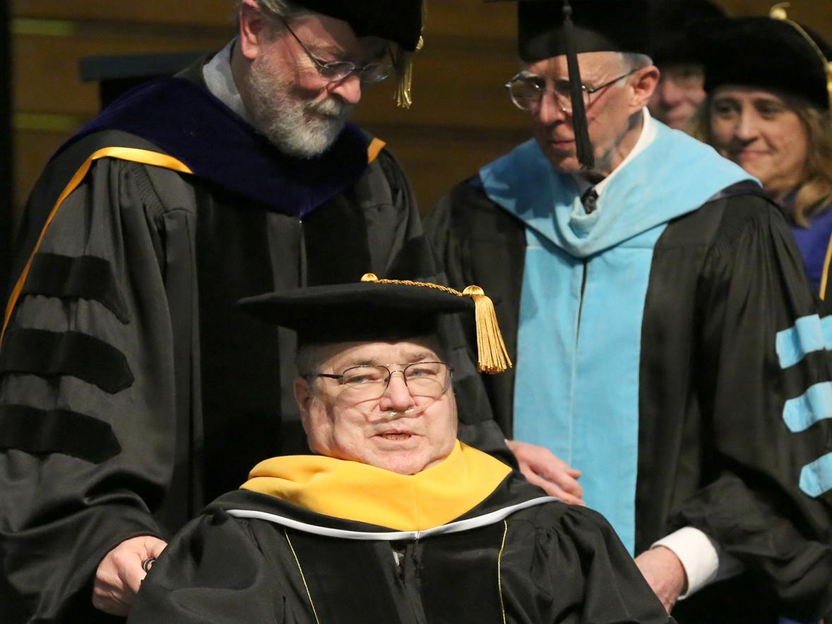 Larry Schneider receives an honorary Doctor of Science degree.