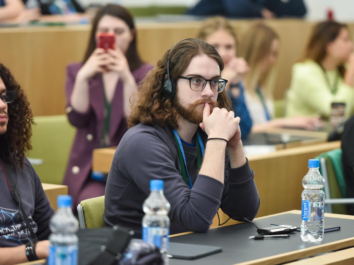 Simon Meyer listening at Moscow lecture.