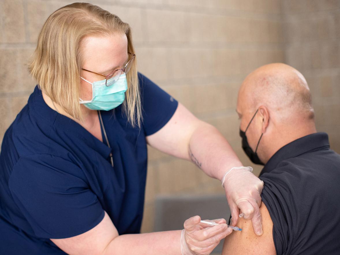 UW-Stout employee Zenon Smolarek is vaccinated against COVID-19 during a recent pop-up clinic on campus.